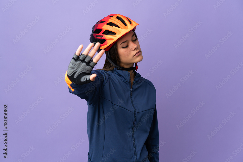Teenager cyclist girl making stop gesture and disappointed Teenager cyclist girl making stop gesture and disappointed