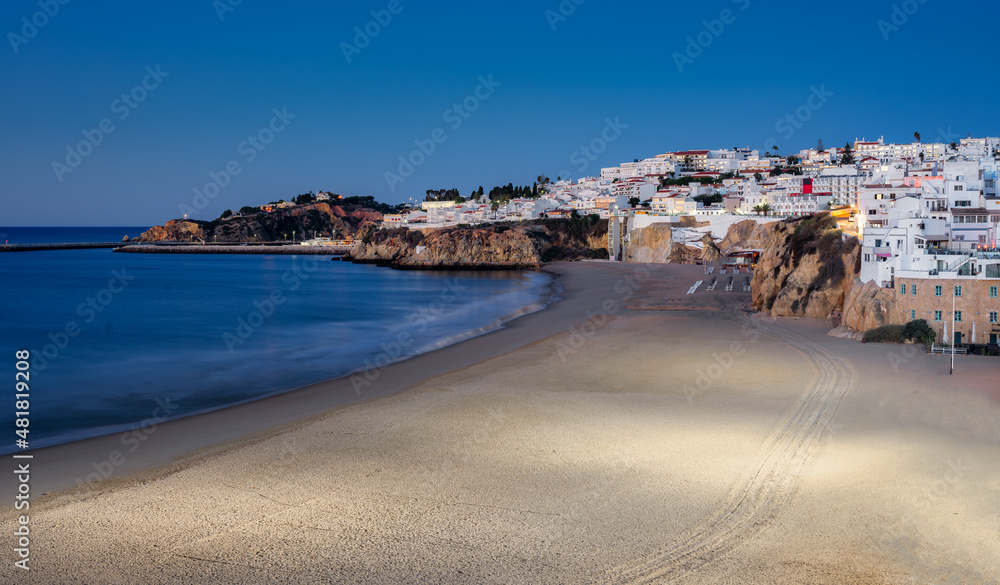 view of the city of Albufeira and the fishermen's beach golden hour.