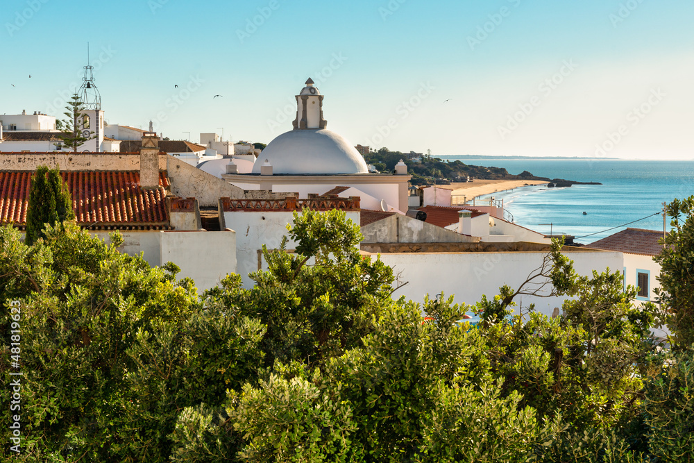 Albufeira's city skyline in the Algarve with houses and church towers - Portugal.