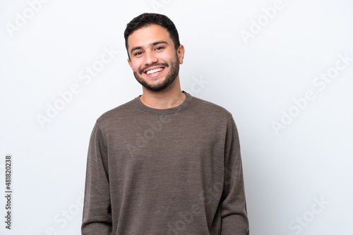 Young Brazilian man isolated on white background laughing photo