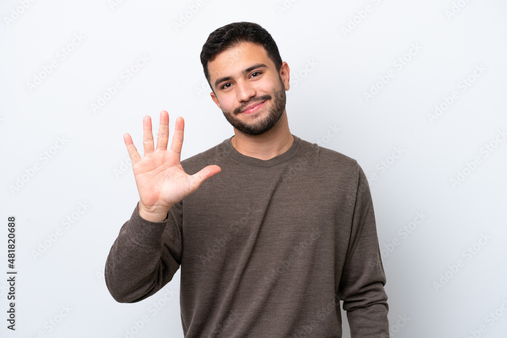 Young Brazilian man isolated on white background counting five with fingers Young Brazilian man isolated on white background counting five with fingers