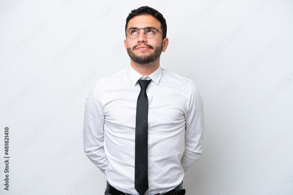 Business Brazilian man isolated on white background and looking up Business Brazilian man isolated on white background and looking up