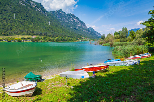 Lake Idro landscape, Boats on the foreground for leisure activities and recreational pursuit.