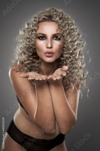 Glamour model with curly blond hair