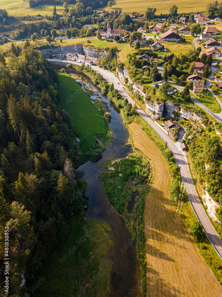 Fototapeta premium Swiss town on a Cliff next to a river