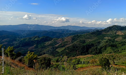 view of the sky, mountains and clouds