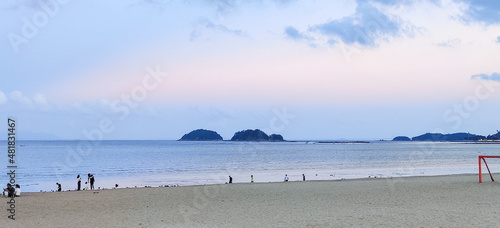 blue sea and sky with clouds and beach