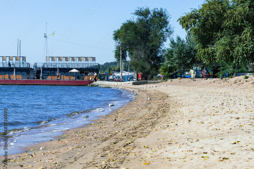sea of Azov, Mariupol, Donetsk region, beach coastline with seascape and pier in the distance