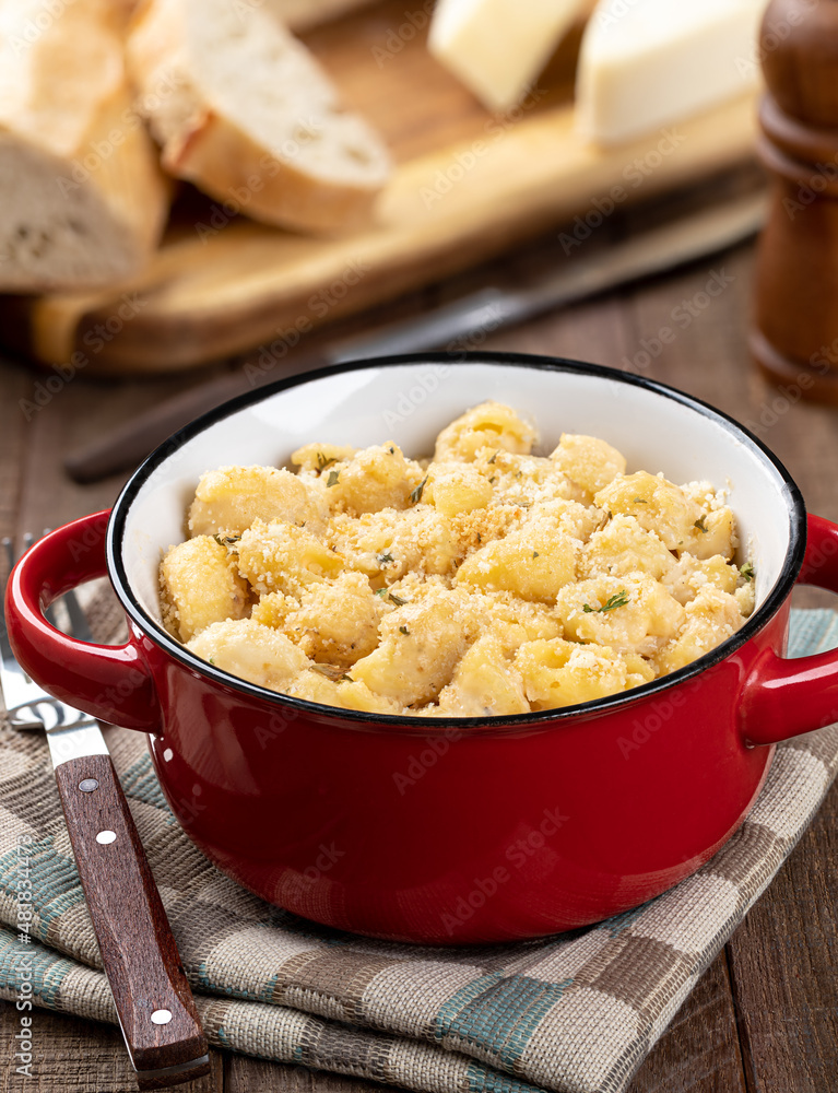Macaroni and cheese in a red dish Macaroni and cheese in a red dish