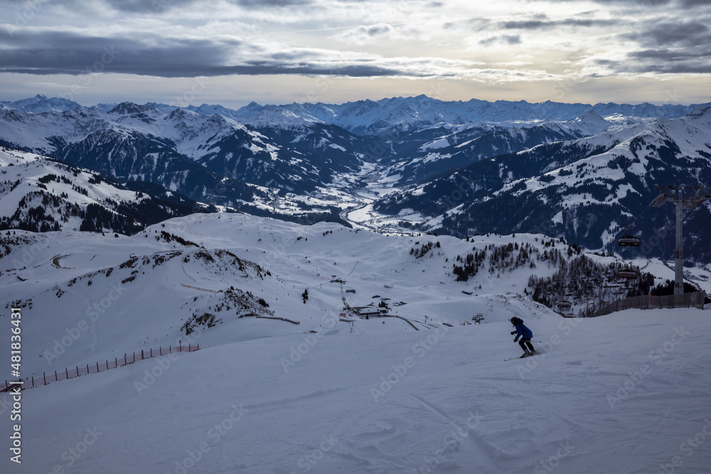 Kirchberg, Austria - December 26, 2021: Ski resort Kitzski in the Alps. Mountain snowy peaks, alpine village