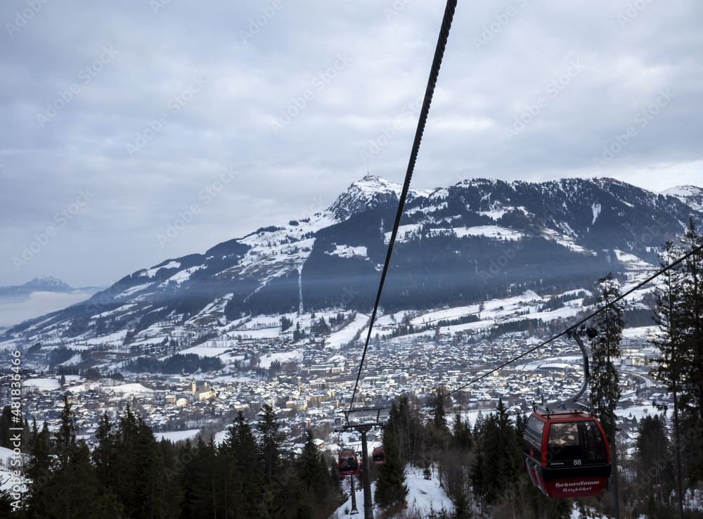 Kirchberg, Austria - December 26, 2021: Ski resort Kitzski in the Alps. Mountain snowy peaks, alpine village