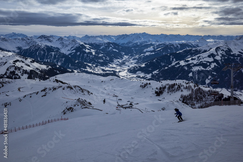 Obraz na płótnie Kirchberg, Austria - December 26, 2021: Ski resort Kitzski in the Alps. Mountain snowy peaks, alpine village w salonie