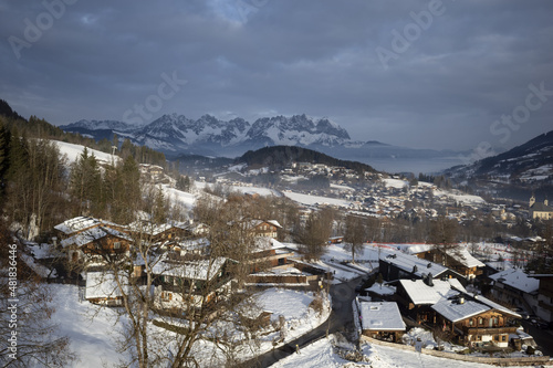 Obraz na płótnie Kirchberg, Austria - December 26, 2021: Ski resort Kitzski in the Alps. Mountain snowy peaks, alpine village w salonie