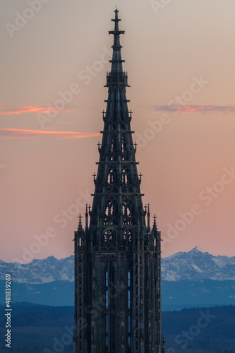 Minster in Ulm at sunset with mountains alps in the background in winter