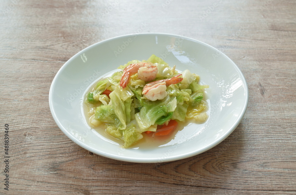 fried slice cabbage and carrot with shrimp in soy sauce on plate fried slice cabbage and carrot with shrimp in soy sauce on plate