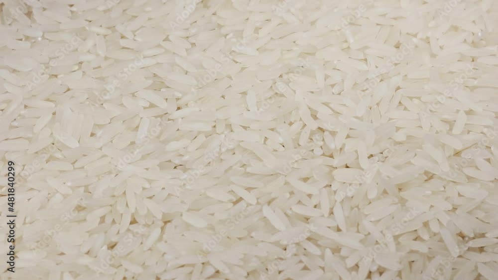 Closeup of uncooked white rice rotating. Closeup of uncooked white rice rotating.