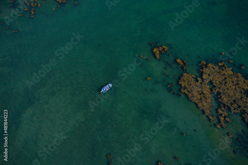 aerial view on a boat of fisher in the middle of the ocean in Brittany