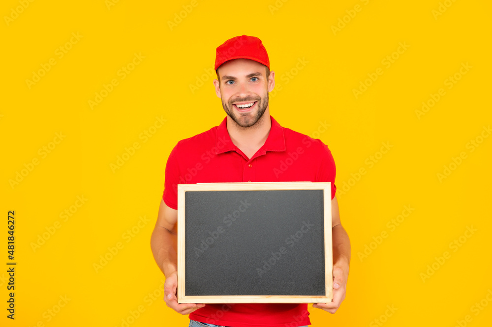 happy man in cap with blackboard. guy make announcement. happy man in cap with blackboard. guy make announcement.