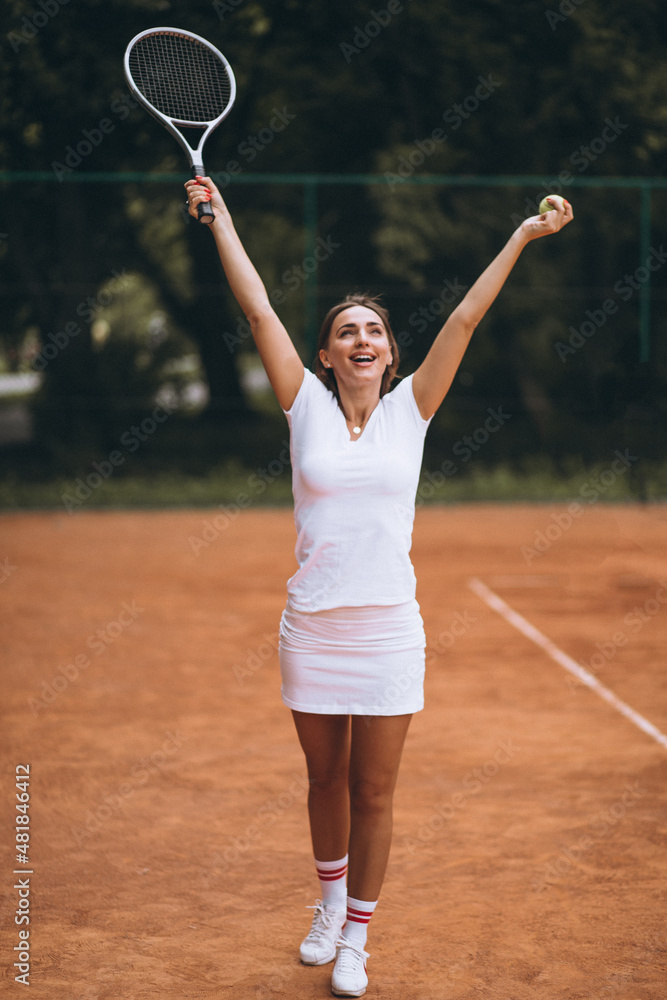 Young woman tennis player at the court