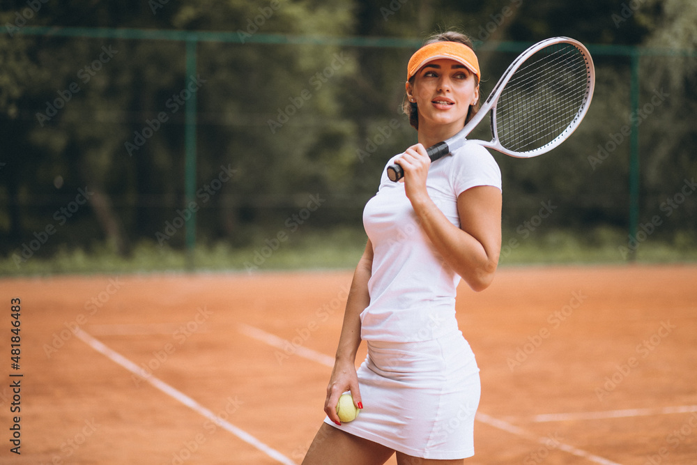 Young female tennis player at the court