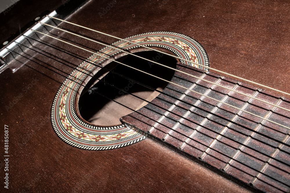 Naklejka premium Close Up of an Old Vintage Acoustic Guitar Strings and Neck