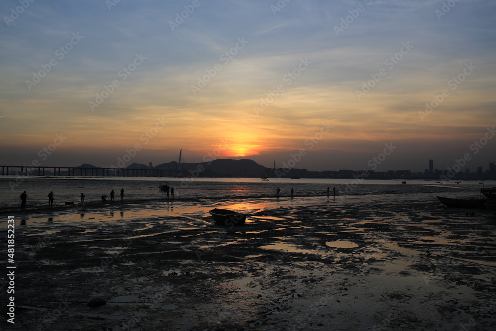 under sunset sea, scenes from hong kong to shenzhen coast at Ha Pak Nai, Yuen Long