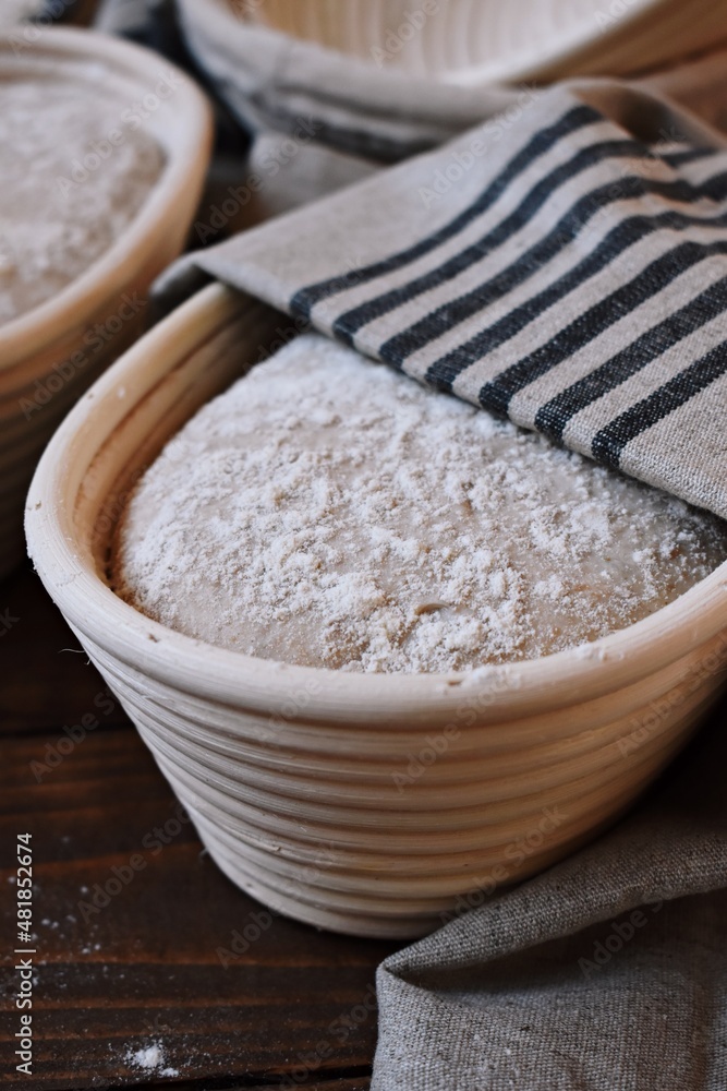 Proofing dough in a special basket. Raise the dough before baking. Yeast-free dough. The fermentation process of the dough. Sourdough bread Proofing dough in a special basket. Raise the dough before baking. Yeast-free dough. The fermentation process of the dough. Sourdough bread