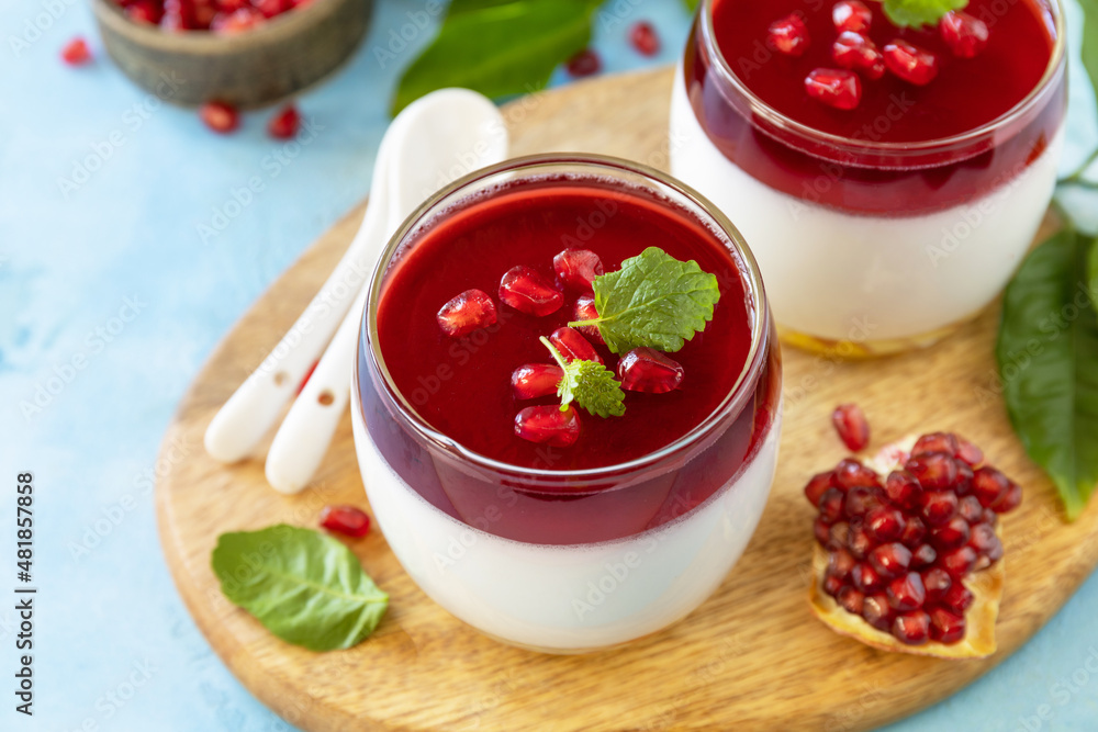 Winter panna cotta with pomegranate jelly and mint, italian dessert, homemade cuisine. Winter panna cotta with pomegranate jelly and mint, italian dessert, homemade cuisine.