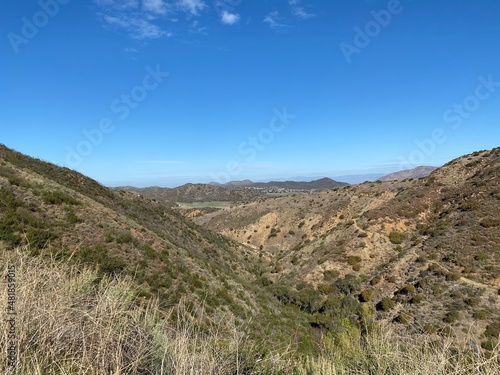 View across the Santa Monica Mountains, Point Mugu State Park, California, with tiny clouds in otherwise clear sky