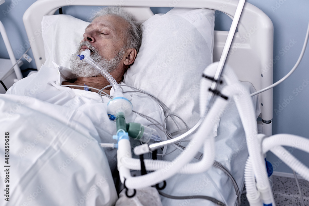 Sick Ill Senior Patient Rests on Bed, Man Sleeping in Modern Hospital Ward.  Caucasian European Male Lying On Medical Bed Alone, Injected With Medical  Equipment Tube In Mouth. Stock Photo | Adobe