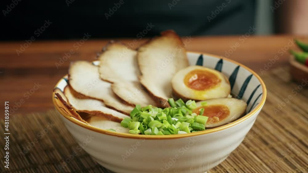Japanese Ramen asian soup noodle with Beef or chicken meat, mushroom and eggs, chef cooking in traditional korean chinese food. Close up of tasty vietnamese cuisine. Japanese Ramen asian soup noodle with Beef or chicken meat, mushroom and eggs, chef cooking in traditional korean chinese food. Close up of tasty vietnamese cuisine.