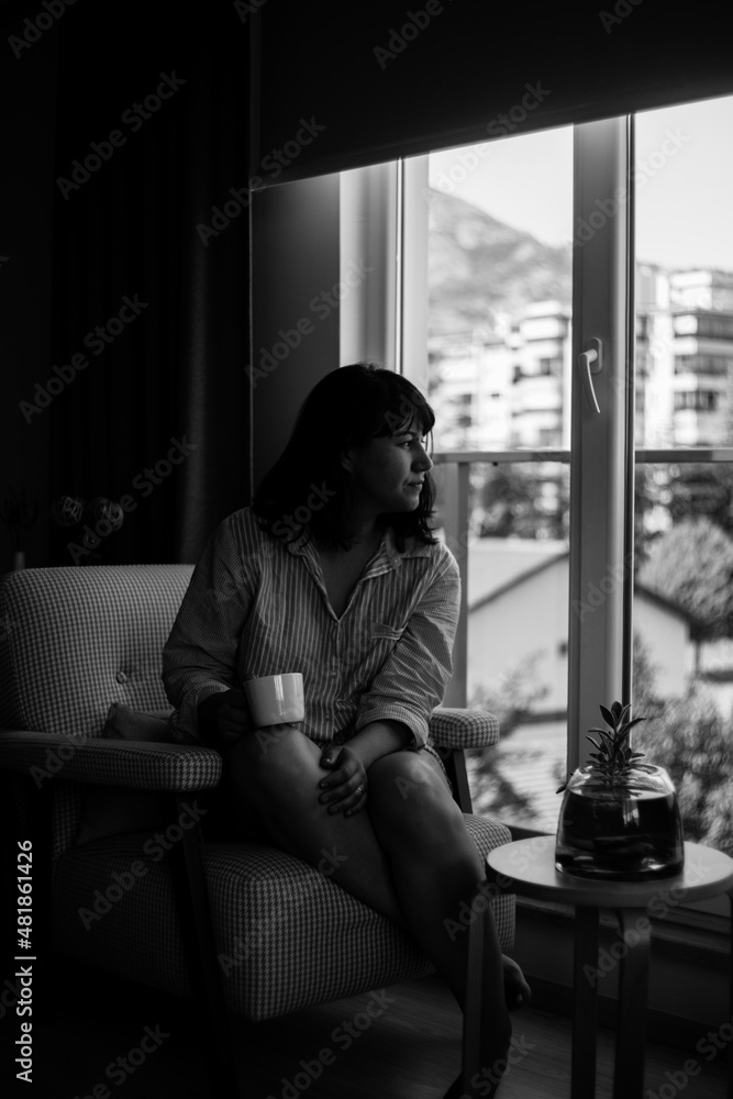 Black and white portrait of young woman drinking morning coffee at home Black and white portrait of young woman drinking morning coffee at home