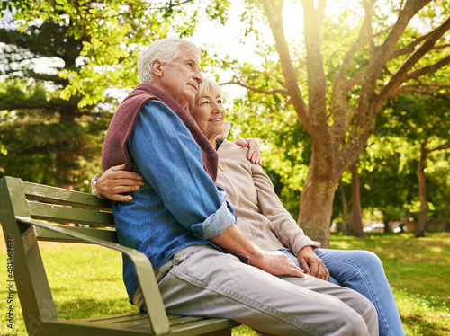 Retired in comfort and happiness. Shot of a happy senior couple relaxing on a park bench. © Anne B/peopleimages.com