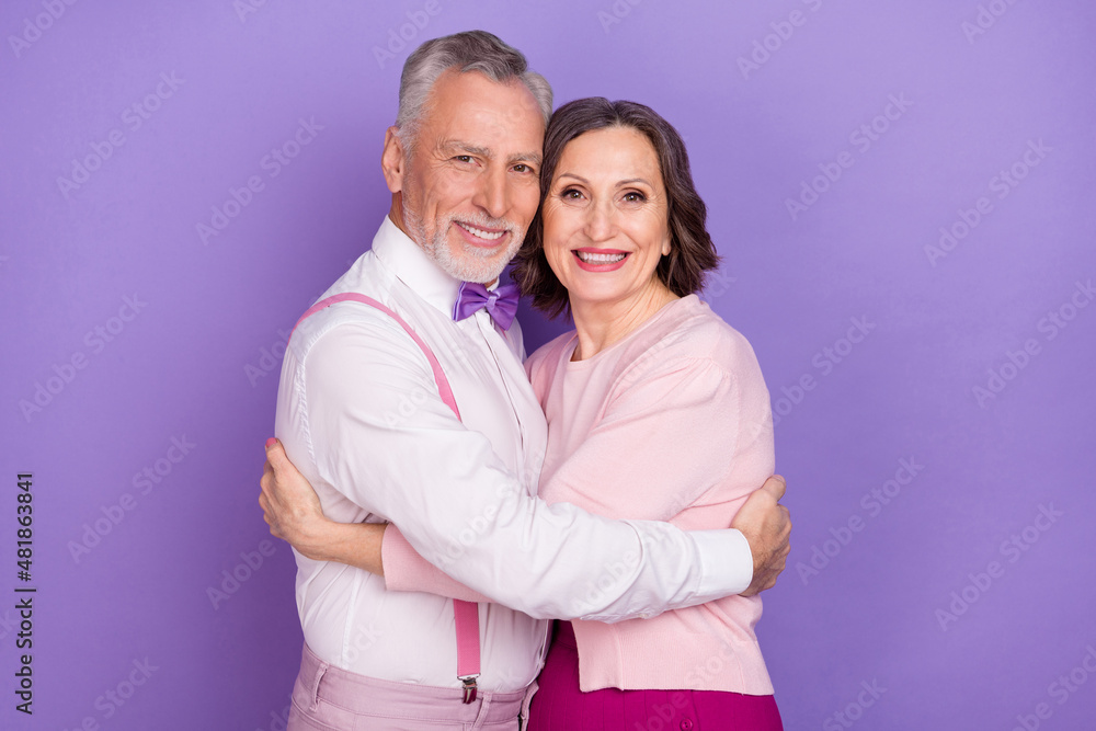 Photo of two peaceful idyllic people embrace feelings affection isolated on violet color background Photo of two peaceful idyllic people embrace feelings affection isolated on violet color background