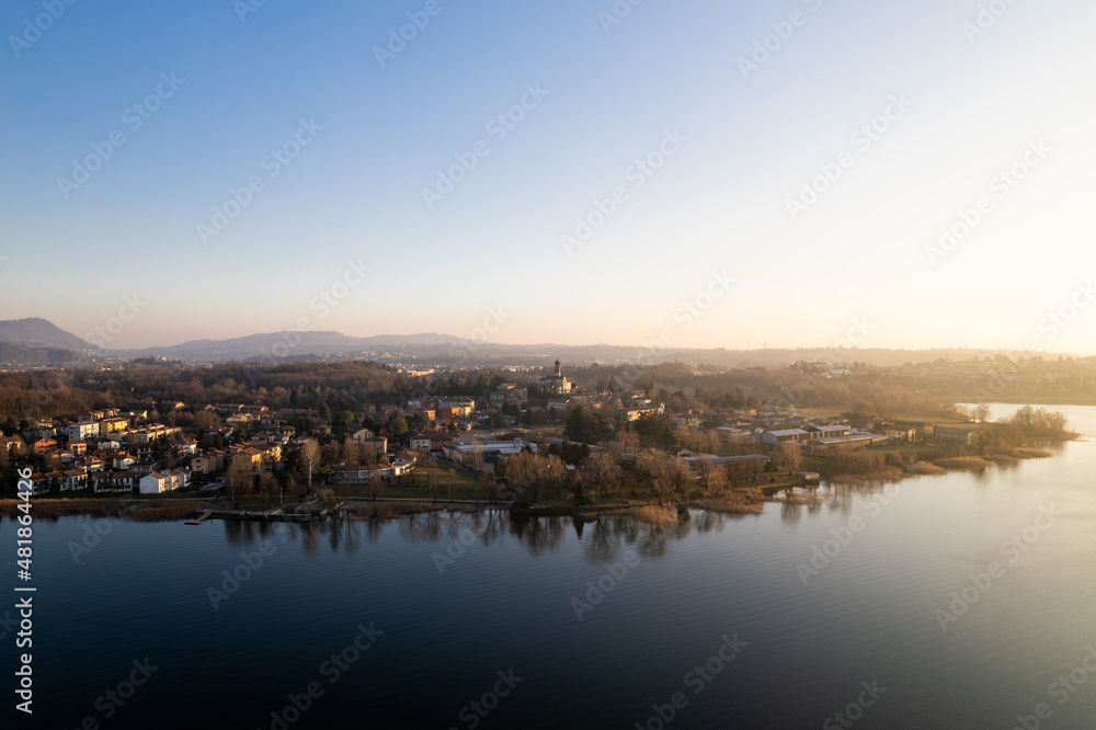 Rogeno seen from Lake Pusiano at sunset in winter. Aerial shot.