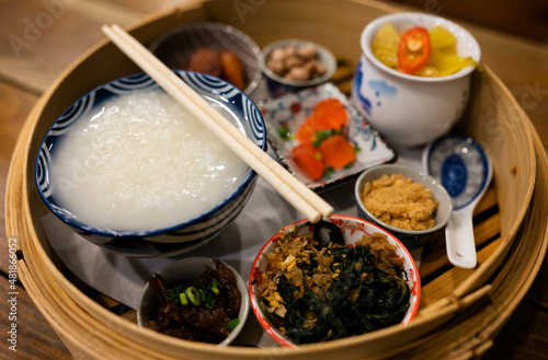Chinese porridge served with various side dishes