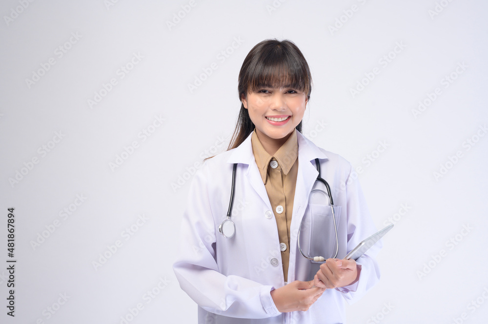 Young female doctor with stethoscope over white background Young female doctor with stethoscope over white background