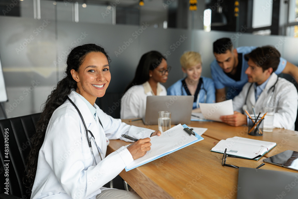 Attractive young woman working on report while morning meeting Attractive young woman working on report while morning meeting