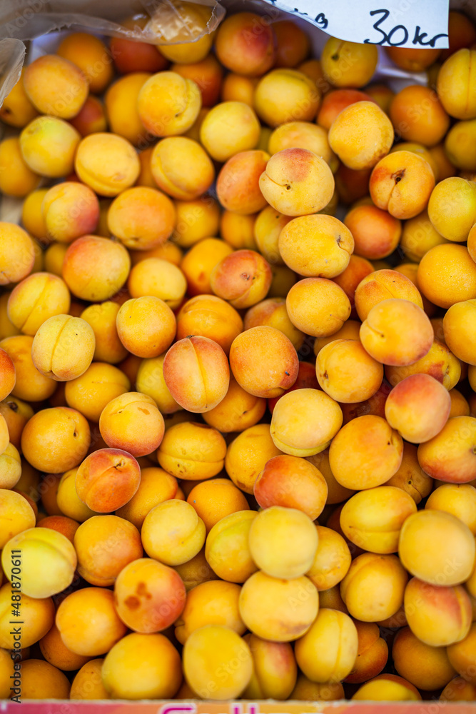 fresh ripe yellow peaches in a box