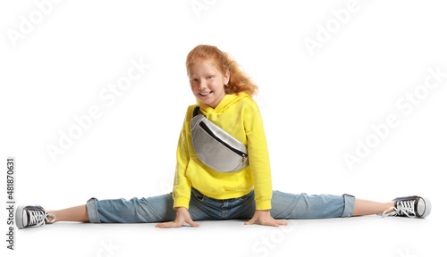 Little redhead girl with bu...
