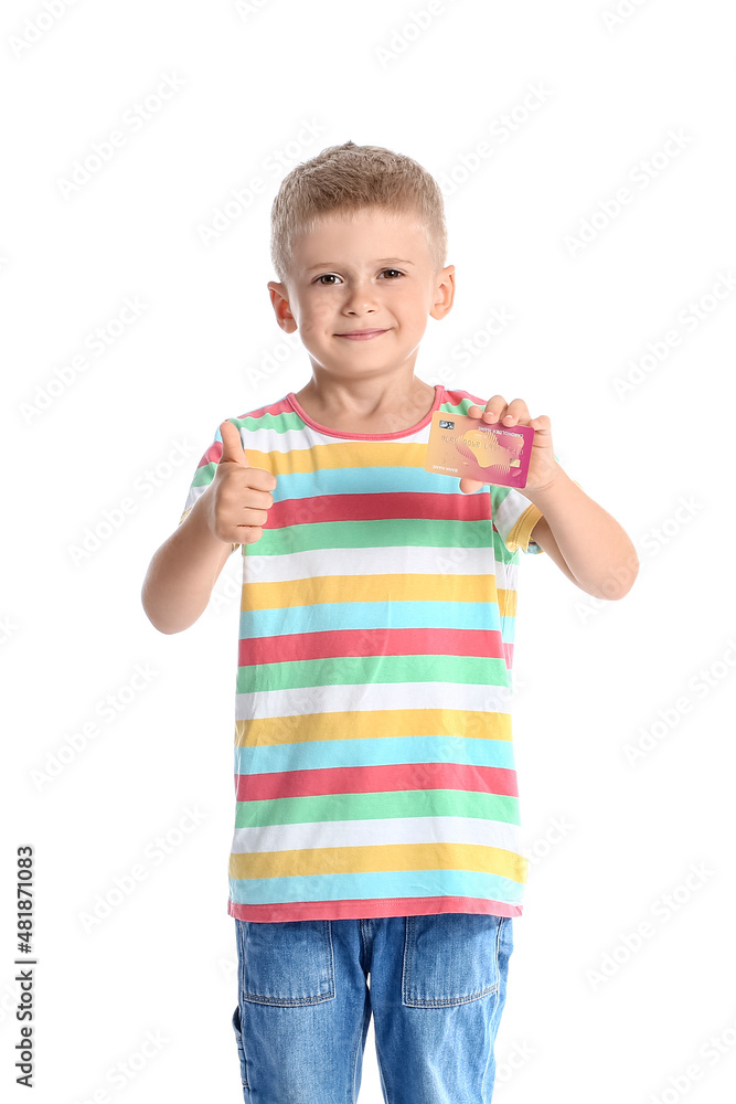 Adorable little boy with credit card showing thumb-up on white background Adorable little boy with credit card showing thumb-up on white background
