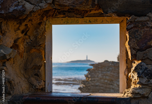 Cape of trafalgar seen from a window in Caños de Meca, south Spain photo
