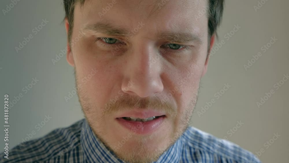 Man splashing small dose of nasal spray in nose. Seasonal cold and flu