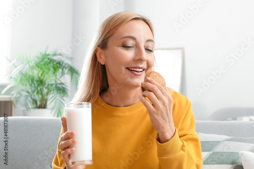 Mature woman drinking milk ...