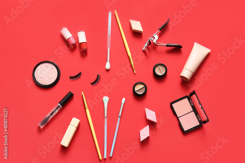 Decorative cosmetics on red background