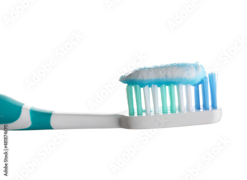 Toothbrush with paste on white background, closeup