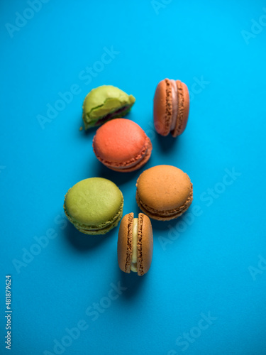 Home made macarons over a blue background