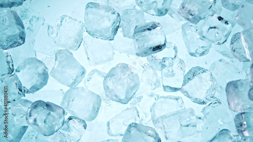 Crystal clear ice cubes background, top view