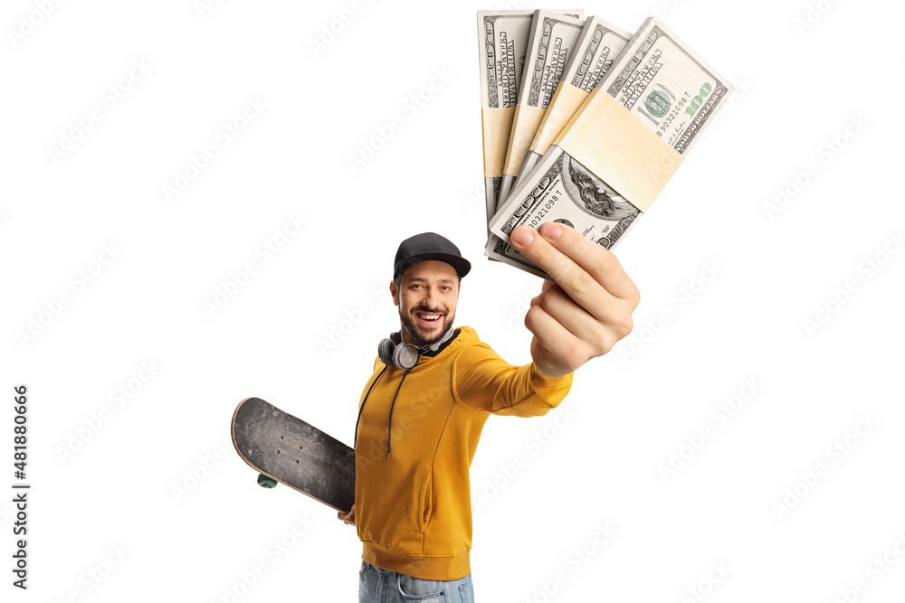 Young man in a yellow sweatshirt holding a skateboard and money Young man in a yellow sweatshirt holding a skateboard and money