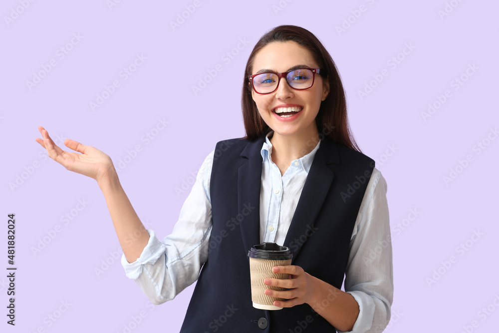Pretty young businesswoman with cup of coffee on lilac background Pretty young businesswoman with cup of coffee on lilac background